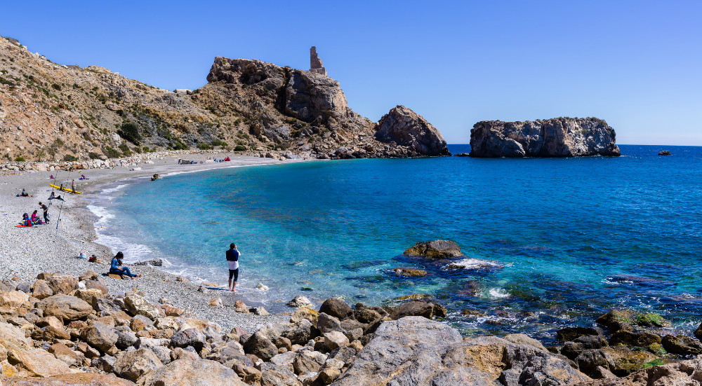 Sandy beach on the Costa Tropical near Granada with Mediterranean sea and mountains in the background